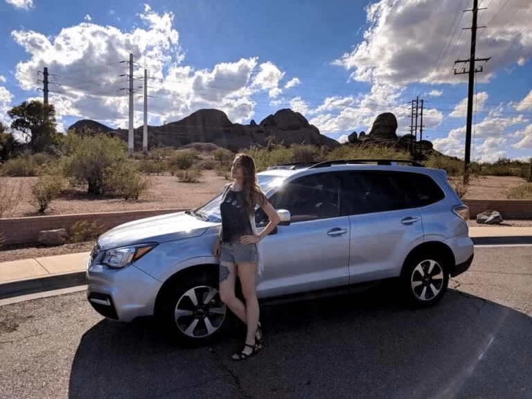 Sara with her new Subaru Forester, delivered by Car Concierge Pro