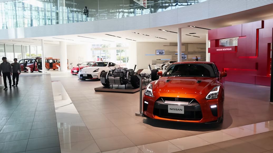 A row of new cars on a dealership lot, where depreciation begins